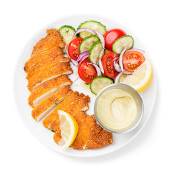 Homemade breaded chicken schnitzel with fresh vegetable salad. isolated on white background