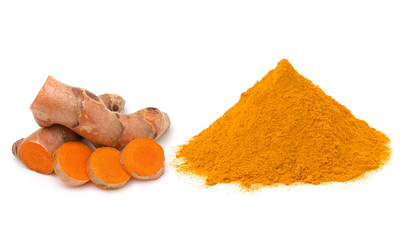 Turmeric (curcumin) rhizomes and powder isolate on a white background.