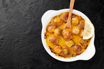 Homemade chicken meatballs in cheddar cheese sauce.