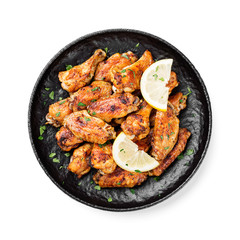 Baked chicken wings served with different sauces and lemon. isolated on white background