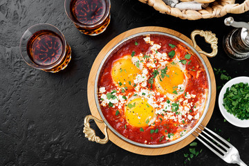 Shakshuka (menemen) fried eggs in tomato sauce for turkish breakfast.