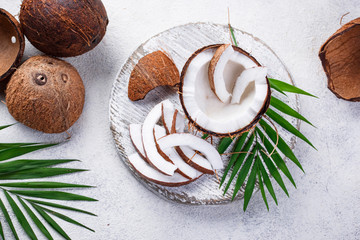 Sliced coconut and palm leaves