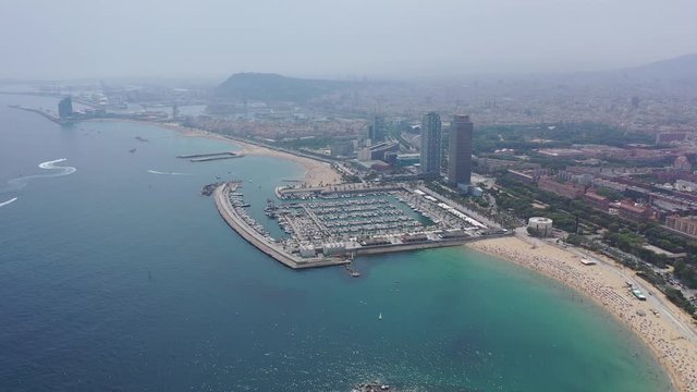 BARCELONA, SPAIN - JULY 07, 2019: Scenic view from drone of seaside area of Barcelona on sunny summer day, Catalonia 