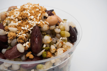 Mix of beans in a transparent cup, Zoom macro.
