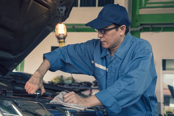  Engineer mechanics working on a vehicle in a garage or service workshop, Service and maintenance vehicle concept