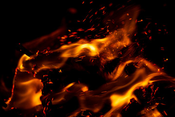 flame of fire with sparks on a black background