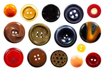 Set of a multiple old sew-through cloth buttons isolated on the white background