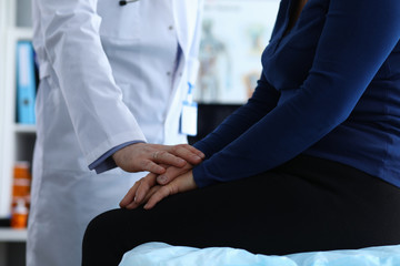 Male doctor reassures patient after examination. Memory problems and fainting. Diagnosis malignant...