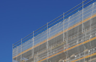 white textile safety net at a metal scaffold