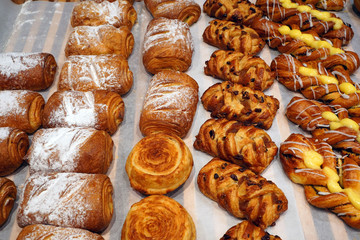 an assortment of delicious buns on the supermarket display with your own pastries