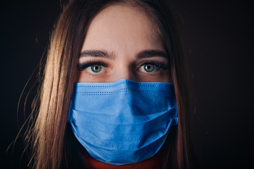 Flu cold or allergy symptom. Sick young woman sneezing in mask isolate on black background. Health care. Studio shot. Business woman wears a mask and coughing, Free from copy space.