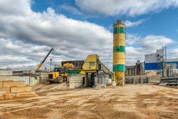 Concrete mixing plant. Visible are the towers for cement storage