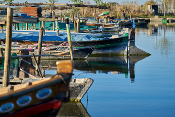 Fototapeta na wymiar reflection of boats docked in a pond