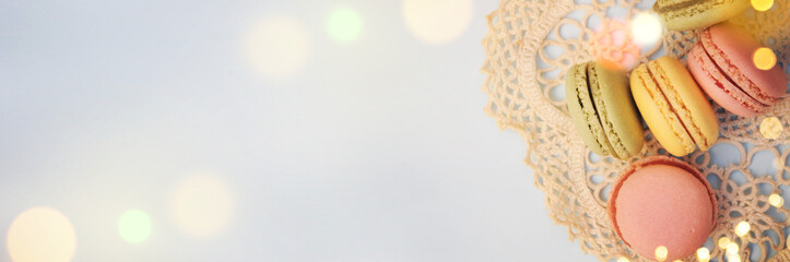 Spring background with blossom and macaroon