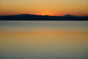 orange sunset on a lake 