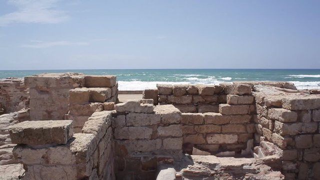 Ancient ruins with ocean in the background
