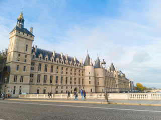 Obraz premium Conciergerie, Paris, France. Splendid Medieval Gothic royal palace that became a revolutionary tribunal and Marie-Antoinette's prison. Pont au Change in the foreground. Sunny day.