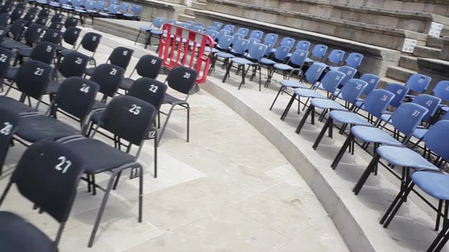 Walk through empty VIP seats in amphitheater