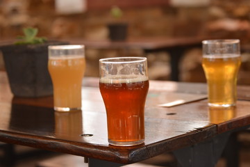 glass of beer on wooden table
