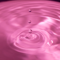 water drop bouncing on the surface of more water