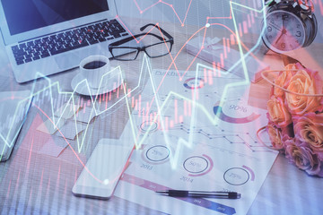 Stock market graph and table with computer background. Multi exposure. Concept of financial analysis.