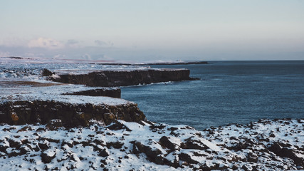 rocks and cliffs on the shore of the Atlantic Ocean in Iceland