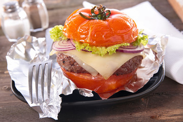 burger with tomato, cheese and beef