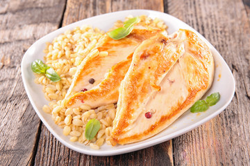 grilled chicken fillet and barley grain