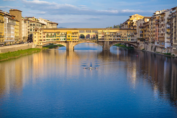 Fototapeta na wymiar Ponte Vecchio Florence. View of medieval stone bridge Ponte Vecchio and the Arno River from the Ponte Santa Trinita (Holy Trinity Bridge) in Florence, Tuscany, Italy, Europe.