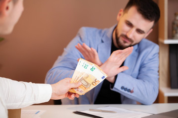 Business man refusing money to take the bribe the concept of corruption and anti bribery