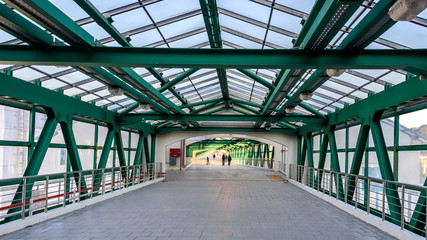 A modern pedestrian crossing of metal and glass