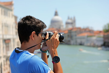 photographer in Venice in Italy with digital camera and the Gran