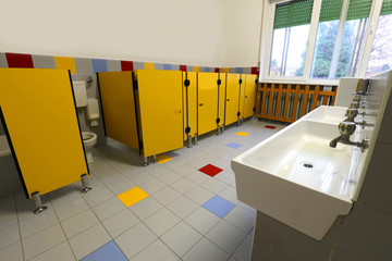 inside a wide bathroom with yellow doors