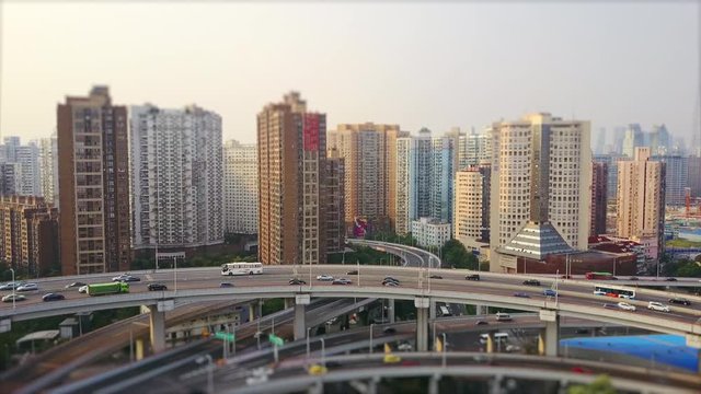 sunny day shanghai cityscape traffic round road junction aerial panorama 4k tilt shift china