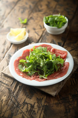 Beef carpaccio with arugula salad