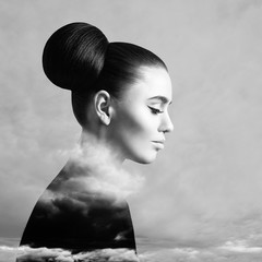 Beautiful woman and sky cloud above background, black and white art portrait