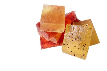 pieces of marmalade red and yellow on a white background