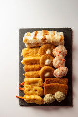 Japanese assorted fish cakes on white background 