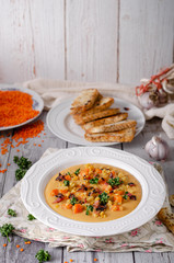 Carrot lentils cream with bacon