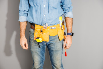 Young man with house instruments stock photo