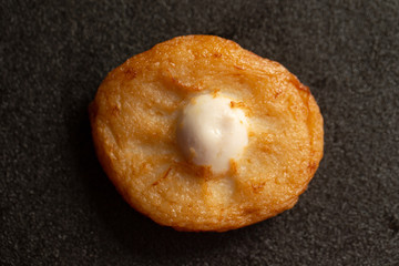 fish cake on black background 