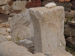 The ruins of an ancient church, traditional architecture, columns in the historical center of the city of Perissa Santorini island.