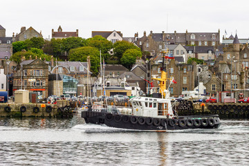 Tugboat on the way in Lerwick Harbor
