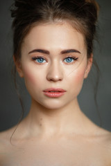  portrait of a young beautiful girl on a neutral background