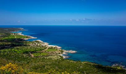 Naklejka na ściany i meble Green mountainous coast of the Mediterranean Sea on the Akamas Peninsula in the northwest of the island of Cyprus.