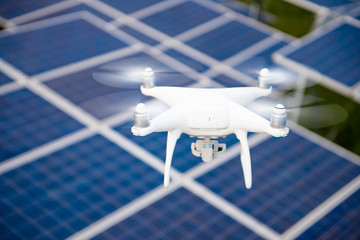 Drones and solar cells, The drone is a high angle camera shooting a solar cell farm. Which is clean energy Able to generate electricity