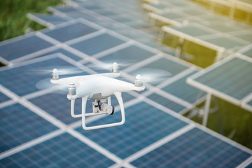 Drones and solar cells, The drone is a high angle camera shooting a solar cell farm. Which is clean energy Able to generate electricity