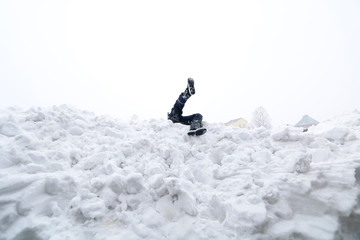 legs sticking out of the snow
