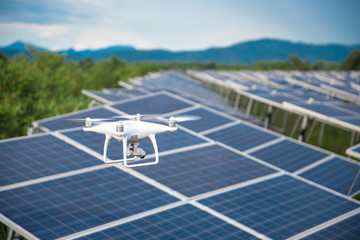 Drones and solar cells, The drone is a high angle camera shooting a solar cell farm. Which is clean energy Able to generate electricity