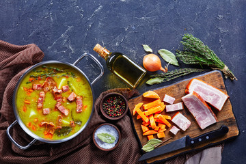 Split pea soup with bacon, pork ham, flat lay
